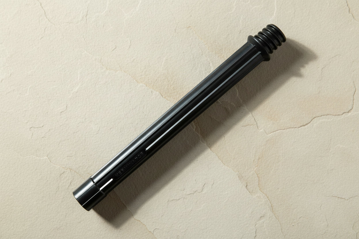 Black cartridge housing lying on flagstone