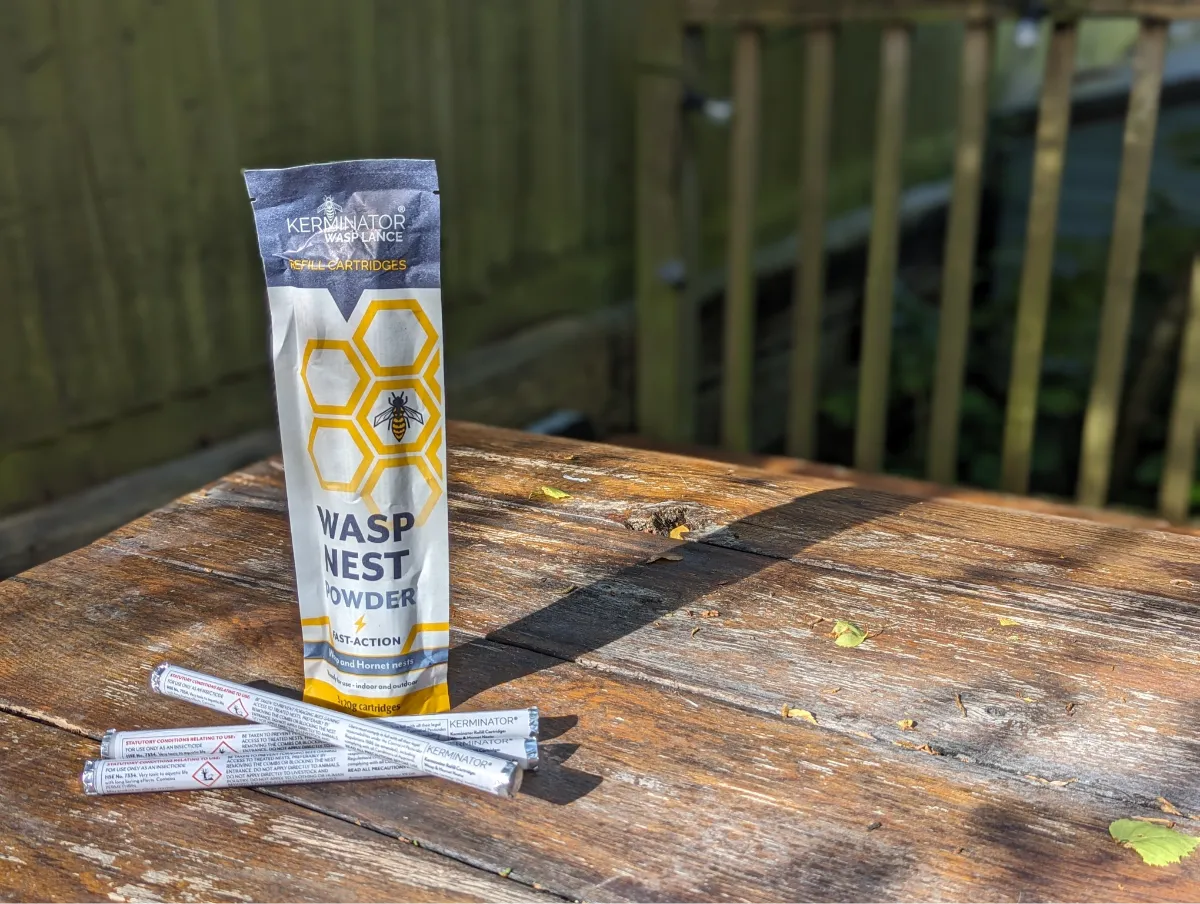 Wasp nest powder package on a wooden table with a blurred background